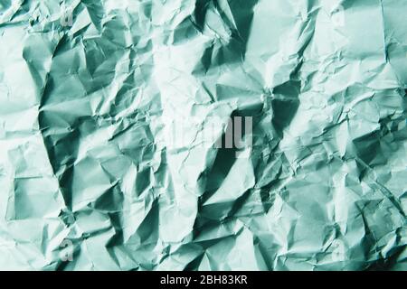 A crumpled paper background. Light blue color. Stock Photo