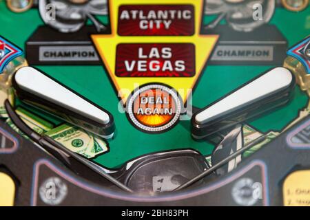 Close-up on the flippers of a vintage pinball machine. Stock Photo