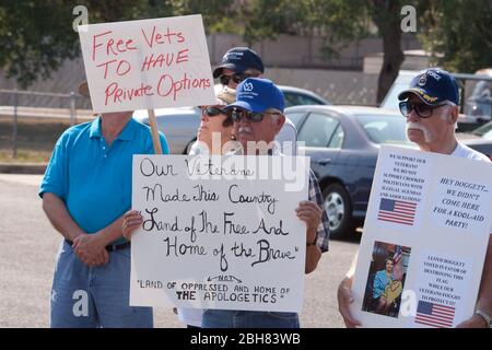 LaGrange Texas USA, September 3, 2009. Protesters picket the ribbon-cutting and dedication ceremony for a regional Veteran's Administration outreach health clinic in rural Fayette County, halfway between Austin and Houston. The protesters want veterans to be allowed to choose private health care providers rather than be tied to the federal Veterans Administration health system. ©Bob Daemmrich Stock Photo