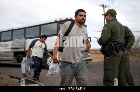 Presidio, Texas USA, December 9 2009: Mexican nationals caught by the U.S. Border Patrol in Arizona are sent across the remote international bridge between Presidio, TX and Ojinaga, Chihuahua, Mexico as part of the ATEP program that attempts to break the cycle of illegal aliens returning back to the United States. ©Bob Daemmrich Stock Photo