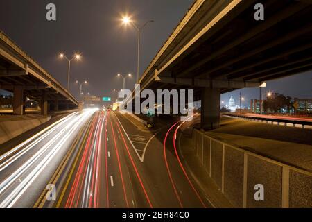 Austin Texas USA, October 5, 2009:  Night-time traffic rolls into downtown Austin along Interstate 35 at Manor Road in a time-exposure from the highway overpass. ©Bob Daemmrich Stock Photo