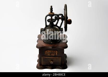 beautiful still life old wooden coffee grinder on white background Stock Photo