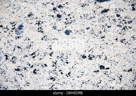 Old cracked dirty black and white painted marble surface. Stock Photo