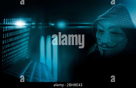 Anonymer Computerhacker mit Maske und Kapuze Stock Photo