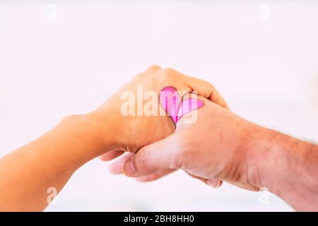 Valentine's day heart concept designed on couple aged hands - white studio background and love forever pict Stock Photo