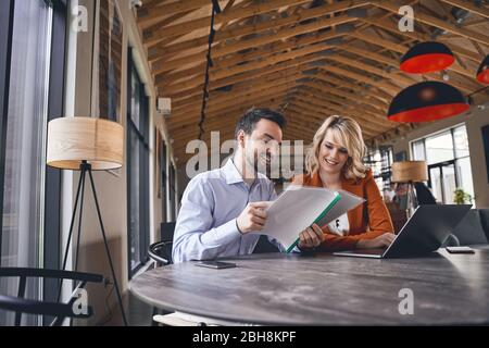 Pleased private tutor checking her students homework Stock Photo