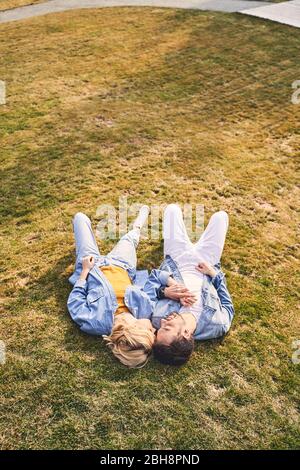 Loving contented boyfriend holding his girlfriends hand Stock Photo