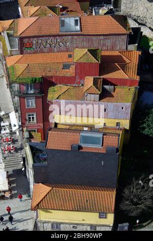 View looking down from Ponte Luis I on to the colourful rooftops of buildings on the quayside in the Ribeira district of Porto, Portugal. Stock Photo