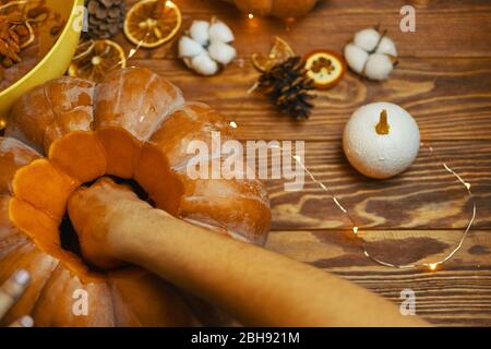 Process hands cutting with knife character face on pumpkin object preparation to halloween holiday. Stock Photo