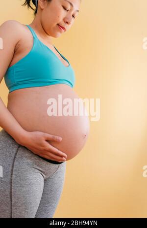 Close-up: Pregnant Woman Proud of her Tummy Stock Photo