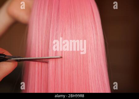 Premium Photo  Wig and scissors - bright black wig - hairstyle background