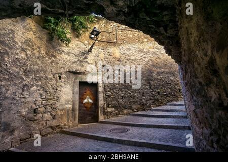 Old stone staircase and stone passage in Girona in autumn. Stock Photo