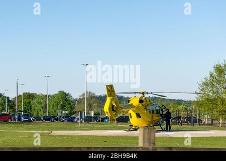 24 April 2020. King's Lynn, Norfolk, UK.  The East Anglian Air Ambulance helicopter G-HEMC, code name Anglia Two, on the ground at the Queen Elizabeth Hospital, King's Lynn.  Credit: UrbanImages-News/Alamy Stock Photo
