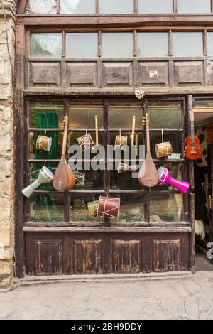 Azerbaijan, Sheki, traditional instruments outside music shop Stock Photo