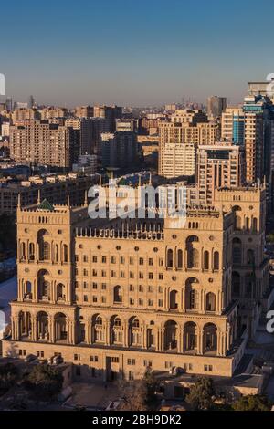 Azerbaijan, Baku, high angle skyline with Dom Soviet Government House, dusk Stock Photo