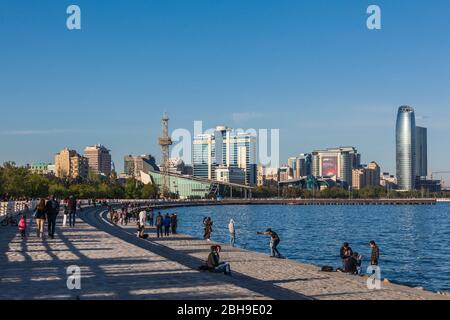 Azerbaijan, Baku, Bulvar Promenade, city skyine from Baku Bay with visitors, no releases Stock Photo