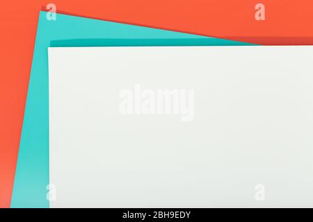 Abstract orange, green and gray color paper geometry composition background. Group of three color cardboard. Copy space Stock Photo