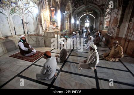 Limited people offer congregational Friday prayers during a complete lockdown from 12 noon to 3:30pm to prevent people from participating in congregational Friday prayers due to increasing in coronavirus cases as preventive measure against the spread of the Coronavirus (COVID-19), at Mahabat Khan Mosque in Peshawar on Friday, April 24, 2020. The number of confirmed COVID-19 cases in Pakistan rose to 11,429 on Friday after new infections were confirmed in the country. Stock Photo