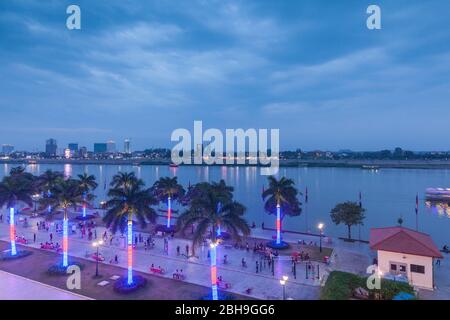 Cambodia, Phnom Penh, elevated view along Tonle Sap Riverfront, dusk Stock Photo