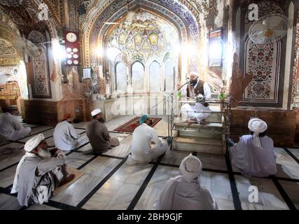 Limited people offer congregational Friday prayers during a complete lockdown from 12 noon to 3:30pm to prevent people from participating in congregational Friday prayers due to increasing in coronavirus cases as preventive measure against the spread of the Coronavirus (COVID-19), at Mahabat Khan Mosque in Peshawar on Friday, April 24, 2020. The number of confirmed COVID-19 cases in Pakistan rose to 11,429 on Friday after new infections were confirmed in the country. Stock Photo