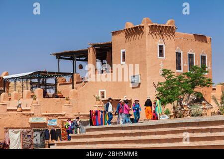 Tourist group in front of a restaurant at Kasbah Taourirt, Ouarzazate, Al-Magreb, Morocco, Africa Stock Photo