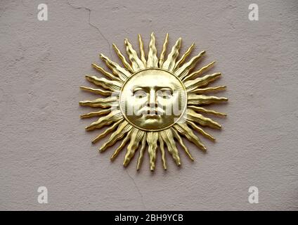 France, Alsace, Colmar, Facade of a pharmacy, house wall, sun, sun symbol, metal sun, face, metal, rays, gilded Stock Photo