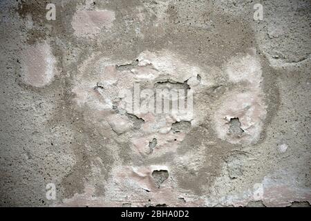 The close-up of a wall with a chipped plaster layer. Stock Photo