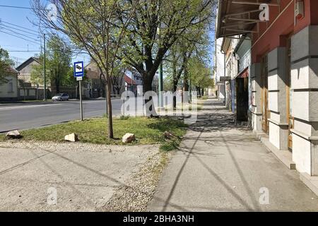 Szeged, Hungary, April 11: A view of a deserted street during a coronavirus quarantine in the city of Szeged on a spring day, April 11, 2020. Stock Photo