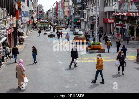 Istanbul, Turkey. 22nd Apr, 2020. General citizen scenes from Bakirkoy square before four days curfew during coronavirus days. Bakirkoy is a neighbourhood, municipality and crowded district on the European side of Istanbul. Turkey began enforcing a four-day curfew in 31 provinces as of midnight April 22 to prevent the spread of the novel coronavirus. As of April 22 Turkey's coronavirus death toll rises to 2,376 as cases top 98,000. Credit: Tolga Ildun/ZUMA Wire/Alamy Live News Stock Photo