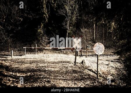 Railroad crossing, barrier out of service, desolate, St. Andrew's Cross, traffic sign closed for vehicles, digitally processed, RailArt Stock Photo