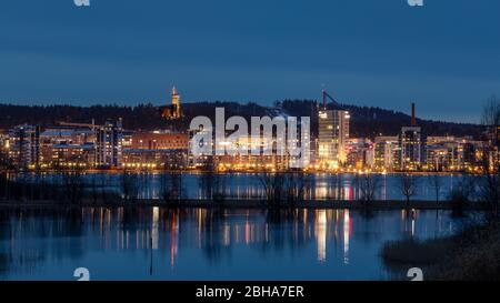 City of Jyväskylä in Finland is built between Jyväsjärvi -lake and a Harju -ridge. Illuminated skyline is spectacular. Stock Photo