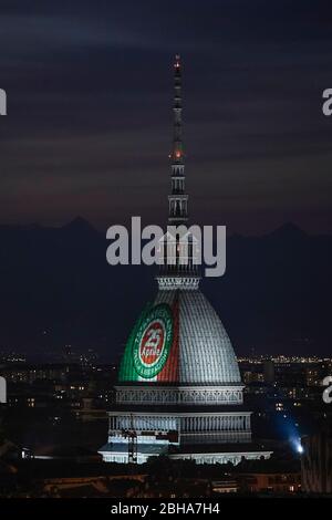 Turin, Italy. 24th Apr, 2020. TURIN, ITALY - April 24, 2020: The Mole Antonelliana, major landmark in Turin, is illuminated with the colors of the Italian national flag and the write '25 April' for the 75th anniversary of the liberation of Italy. April 25 is the Liberation Day (Festa della Liberazione) marking the Italy's liberation from nazis and fascists and the end of the Second World War (WWII) for Italy. The recurring torchlight procession and demonstration are not going to be celebrated due to the COVID19 restrictions. (Photo by Nicolò Campo/Sipa USA) Credit: Sipa USA/Alamy Live News Stock Photo