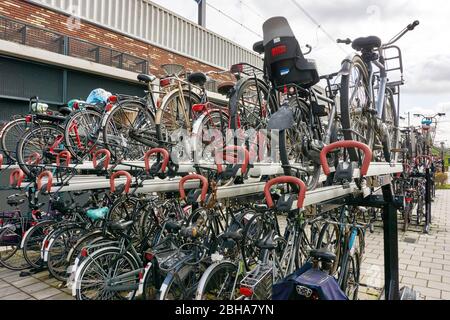 Multi level bicycle storage system with locks in Utrecht The Netherlands Stock Photo