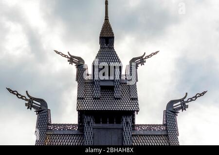 Roof construction of the stave church Fantoft with carved dragon heads in the dramatic sky, Fantoftvegen Paradis, Hordaland, Norway, Scandinavia, Europe Stock Photo