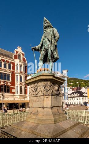 On a stone base the statue of Ludvig Holberg, Baron von Holberg, framed with a white fence, against a bright blue sky, to see behind it the Theta Museum Bergen, Hordaland, Norway, Scandinavia, Europe Stock Photo