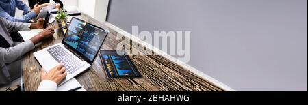 Group Doing Financial Business Analytics On Computer Stock Photo