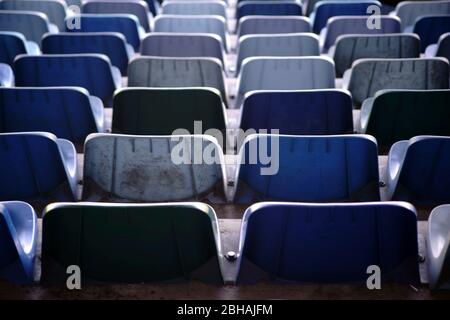 The rear view on the backs and seats of rows of seats in a stadium. Stock Photo