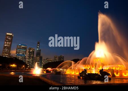 Buckingham Fountain is a Chicago landmark in the center of Grant Park. Dedicated in 1927, it is one of the largest fountains in the world. Stock Photo