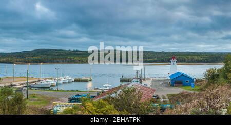 Canada, Nova Scotia, Mabou, Mabou Harbour and Lighthouse, elevated view, dusk Stock Photo