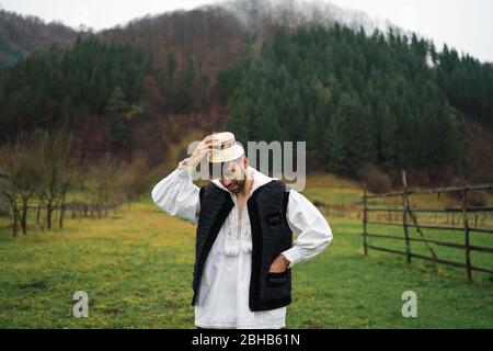 Young man dressed in traditional outfit of northern Romania, Maramures Stock Photo