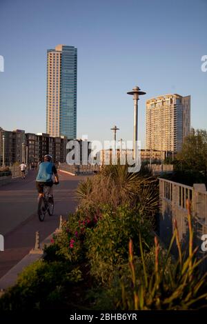 Austin, Texas USA, April 7, 2009: High-rise residential buildings tower above the pedestrian bridge over Lady Bird Lake in downtown Austin at dusk. Construction of new high-rises continues unabated as the Texas economy remains strong through the recession. ©Bob Daemmrich Stock Photo