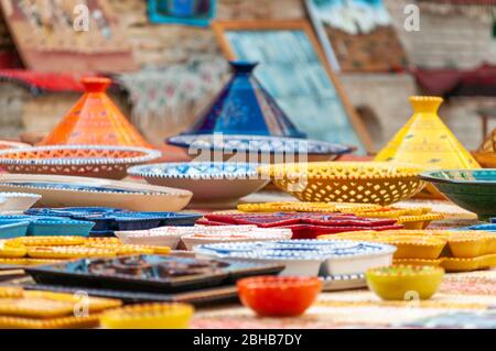 Colorful handcrafted and handpainted pottery sold on a market in Tunisia Stock Photo
