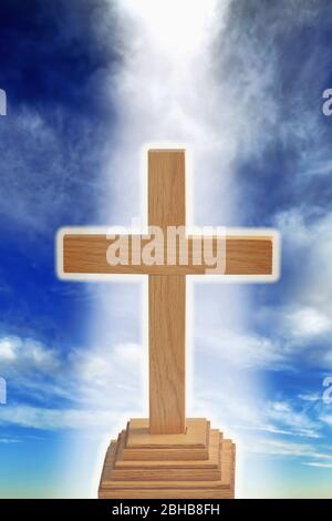 Old rugged cross with heavenly glow. Stock Photo