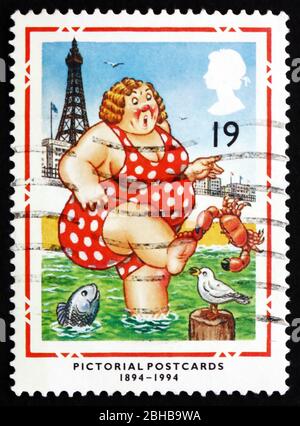 GREAT BRITAIN - CIRCA 1994: a stamp printed in the Great Britain shows Bather at Blackpool, British Picture Postcard, Centenary, circa 1988 Stock Photo
