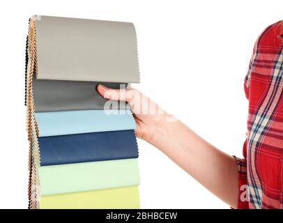 Female hand holding scraps of colored tissue isolated on white Stock Photo