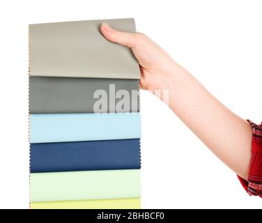 Female hand holding scraps of colored tissue isolated on white Stock Photo