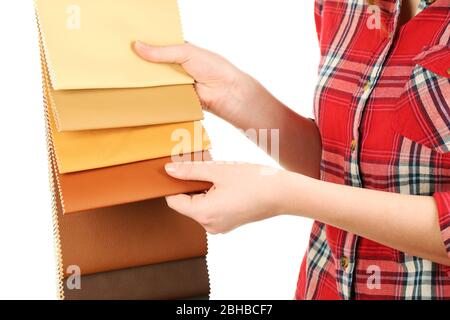 Female hand holding scraps of colored tissue close up Stock Photo