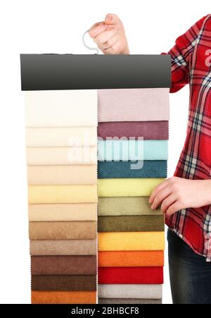 Female hand holding scraps of colored tissue close up Stock Photo