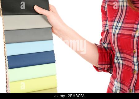 Female hand holding scraps of colored tissue close up Stock Photo