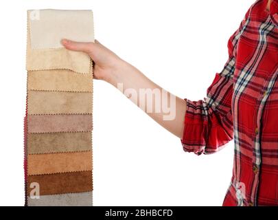 Female hand holding scraps of colored tissue isolated on white Stock Photo